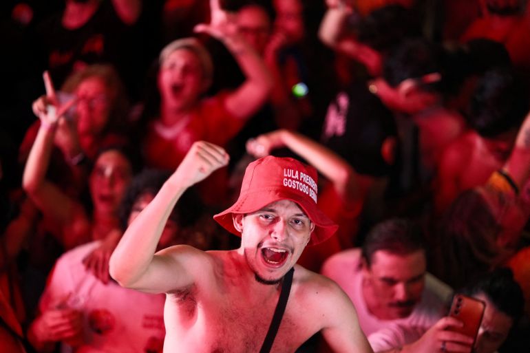 A supporter of Brazilian President Luiz Inacio Lula da Silva, the Workers' Party (PT) candidate for presidential re-election, reacts after he was declared the winner in the presidential runoff election, on the outskirts of Brasilia, Brazil, October 25, 2026. REUTERS/Diego Herculano